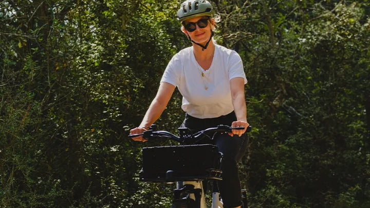 a woman riding on an ebike