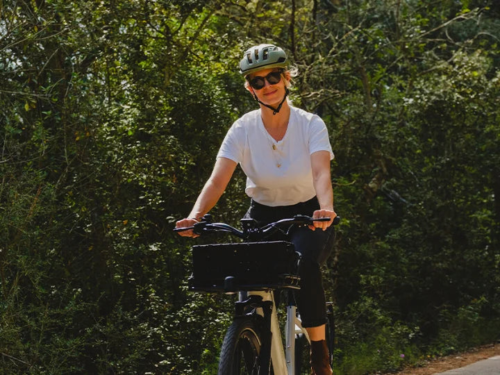 a woman riding on an ebike