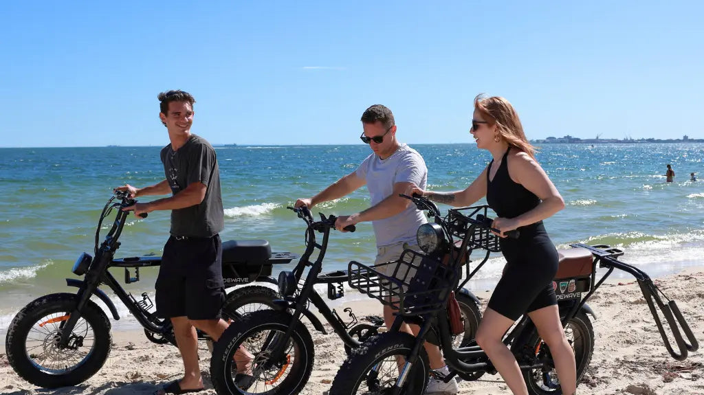 3 people wheeling RideWave Xplorer's at the beach
