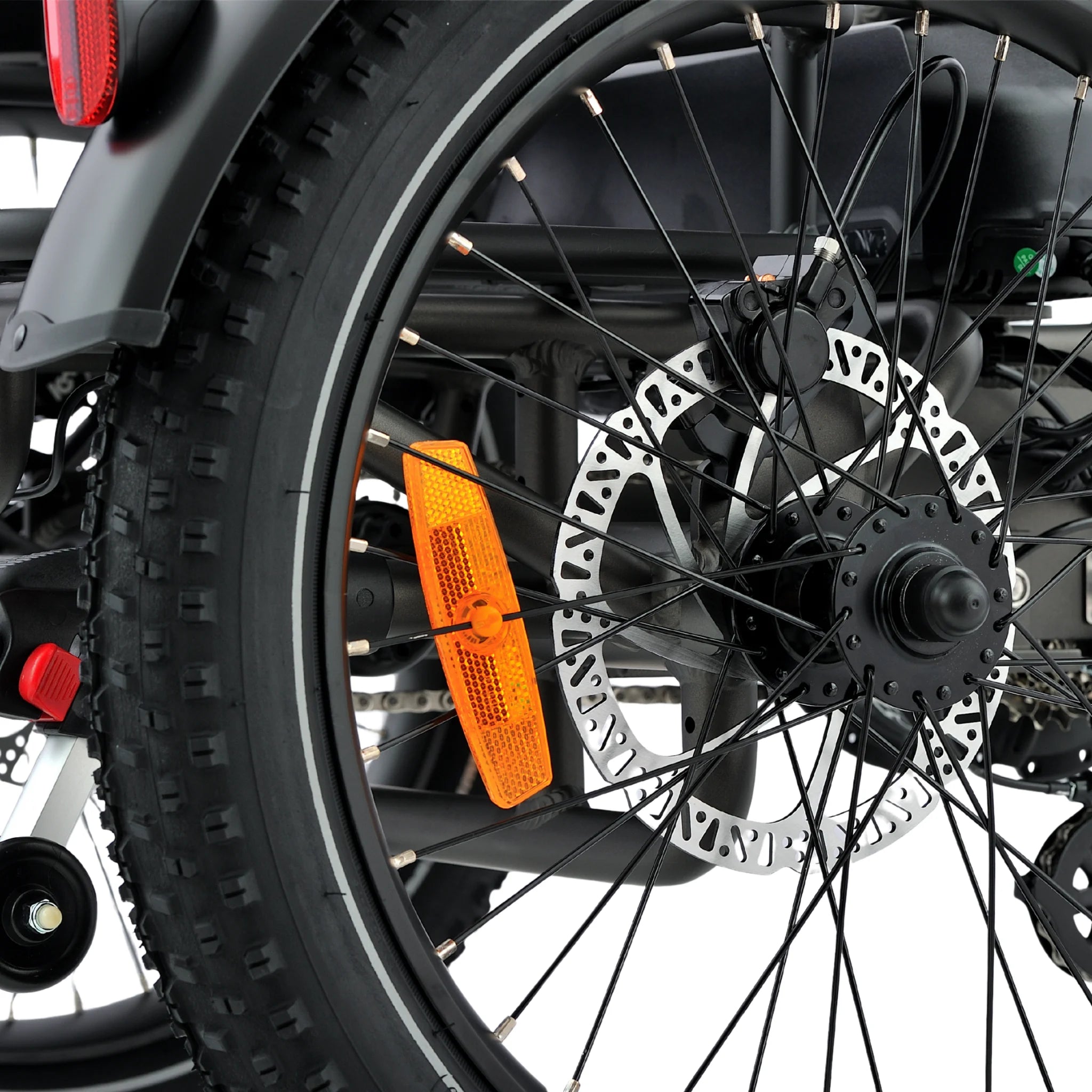 all-groups Close-up of a motorcycle wheel with an orange fender and visible brand name.