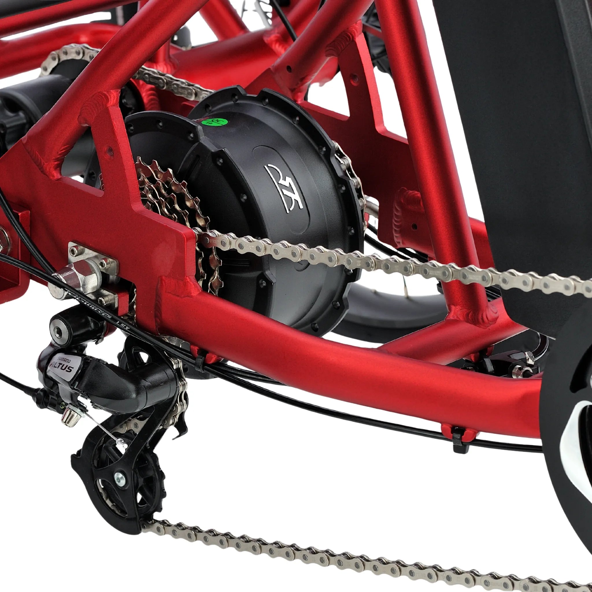all-groups Close-up of a red recumbent bike with chain and gear system on a white background