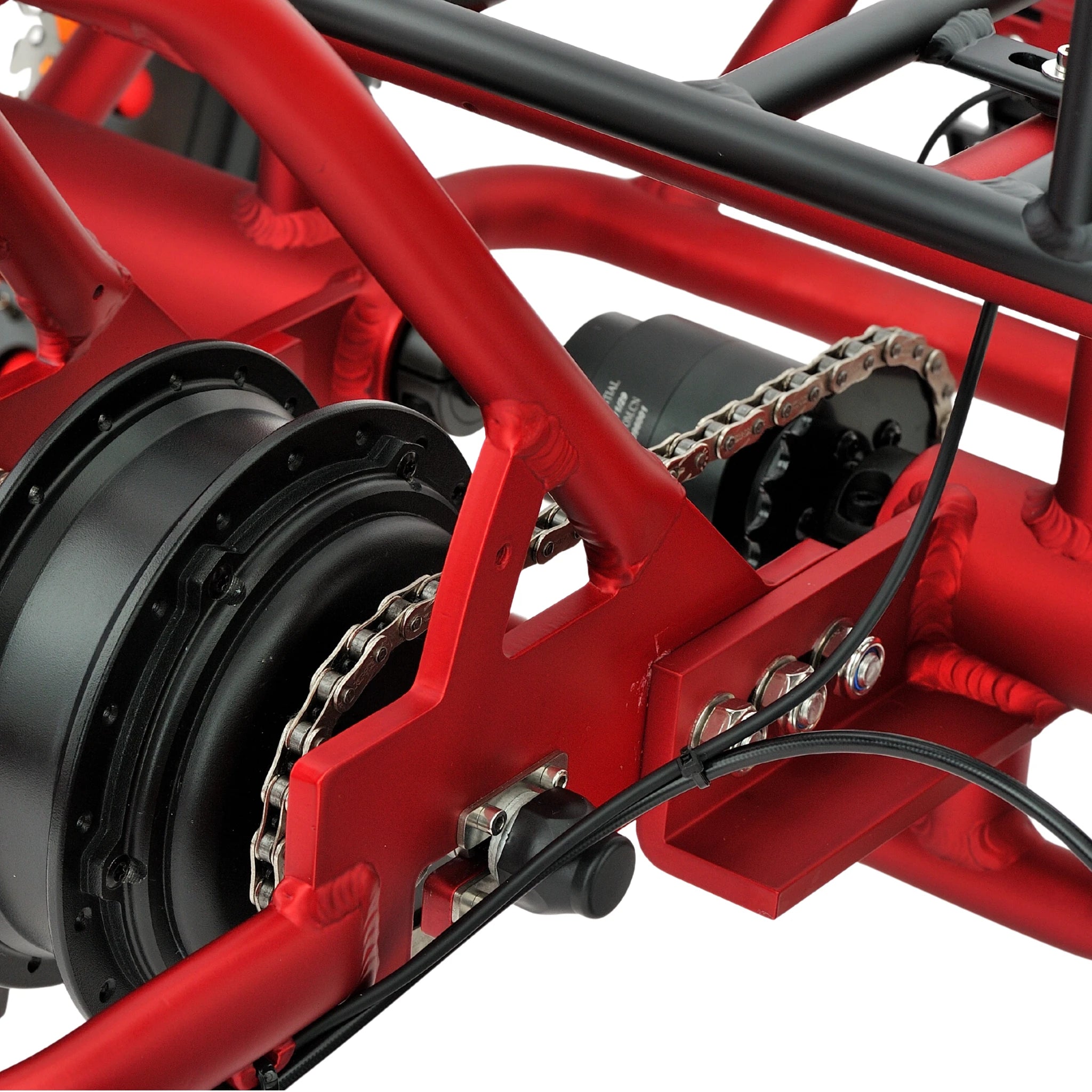 Close-up of a red bicycle frame with chain and gears on a white background