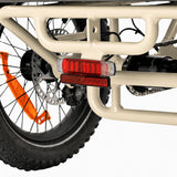 Close-up of a motorcycle's rear wheel and red taillight on a white background #color_cream