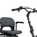 Graphite electric tricycle seat and handlebar on a white background