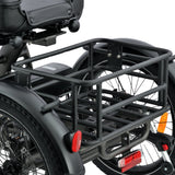 An electric tricycle with a black luggage rack on a white background