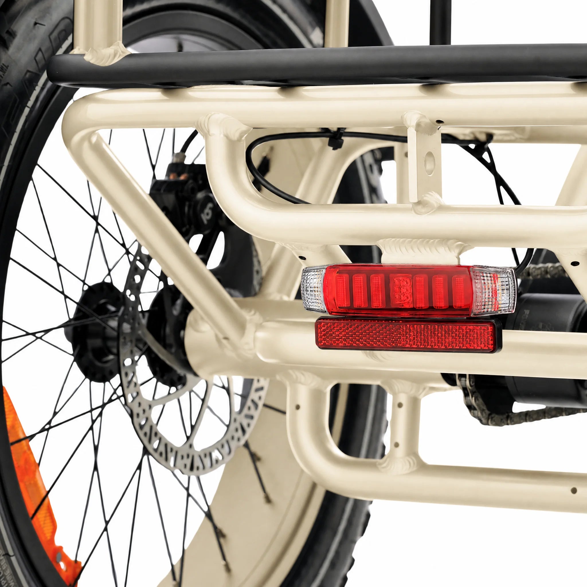 Close-up of a bicycle's rear wheel and frame with red reflectors on a white background #color_cream