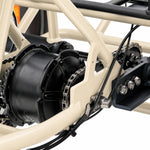 Close-up of a bicycle's gear system with a white frame #color_cream