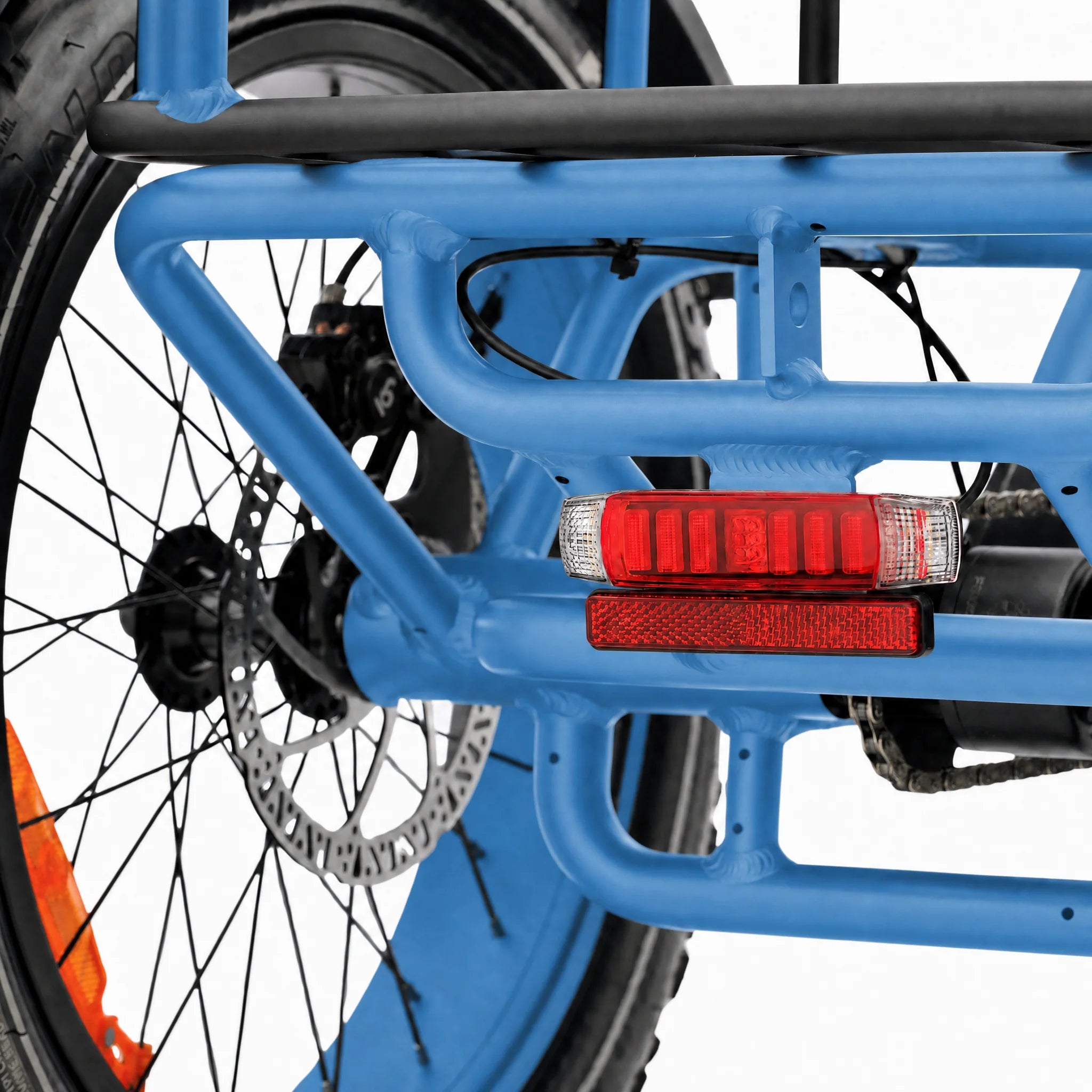 Close-up of a blue bicycle frame with red reflectors on a white background #color_sky-blue