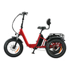 Red electric tricycle with black seat and basket on a white background