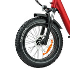 Close-up of a bicycle wheel with Kenda tire on a white background