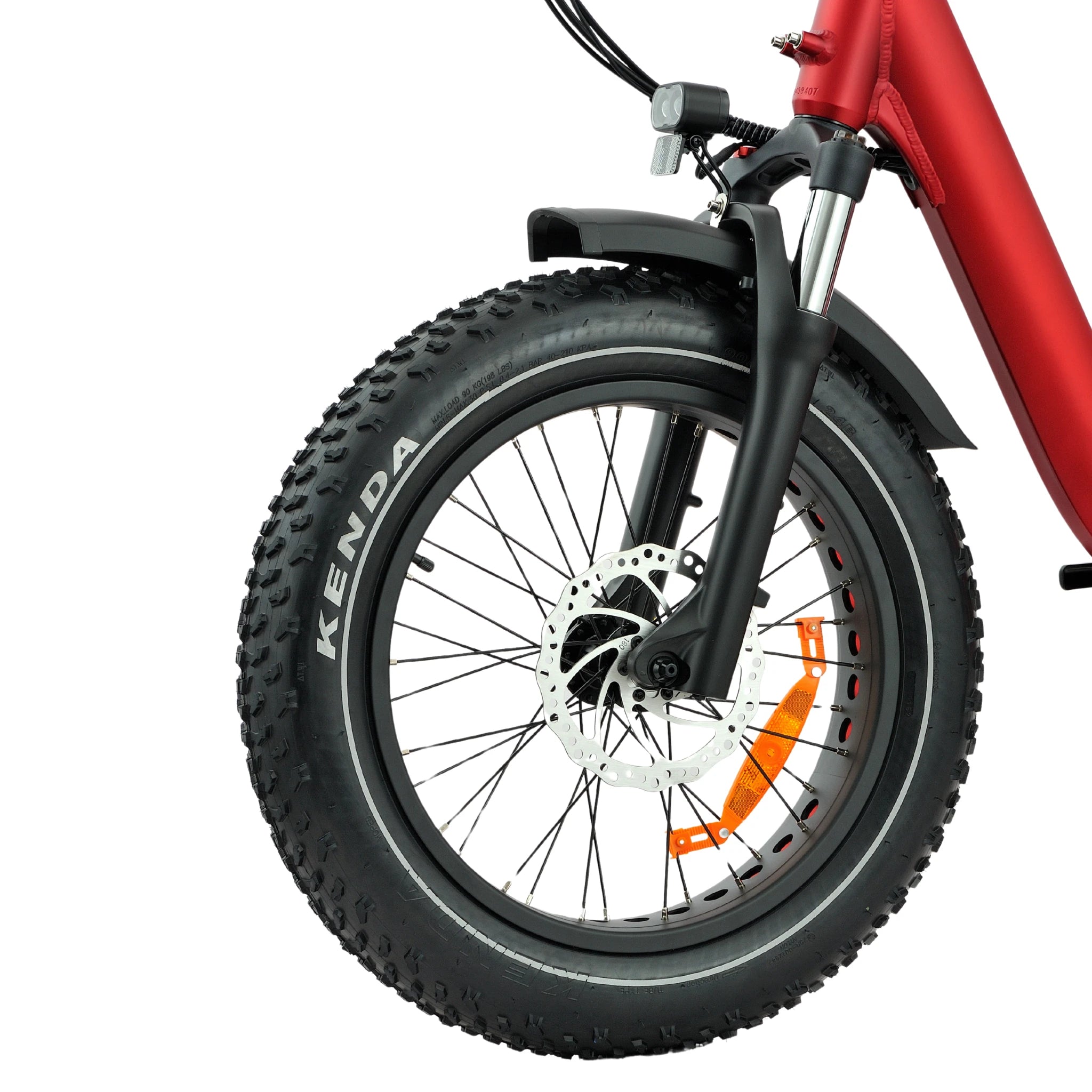 Close-up of a bicycle wheel with Kenda tire on a white background